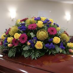 Bright Funeral Casket Arrangement 
