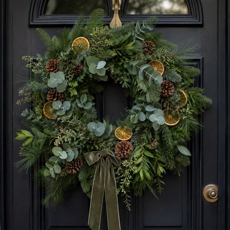     Bespoke handcrafted Christmas door wreath by Bloomin’ Chic Florist Oxford